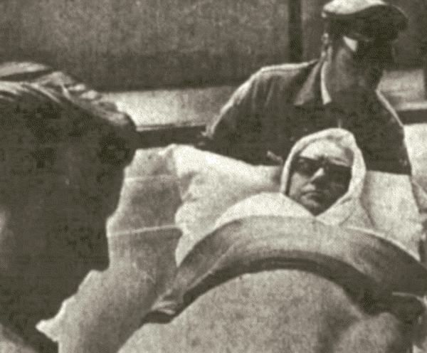 Ricca brought into courtroom on stretcher